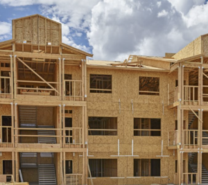 The lumber framing of a mixed-use development encompassing hundreds of apartment units.